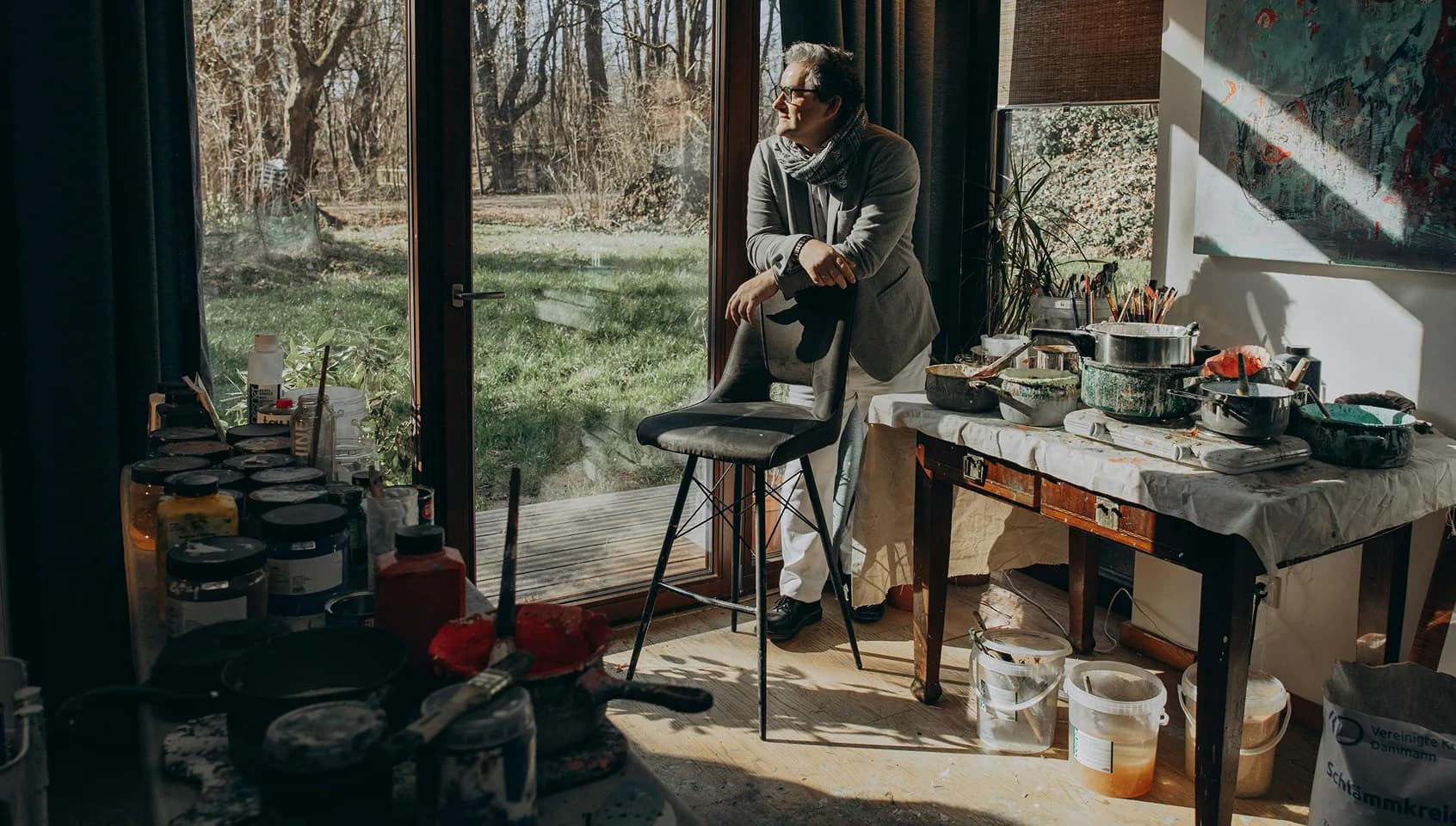 Artist in a sunlit studio