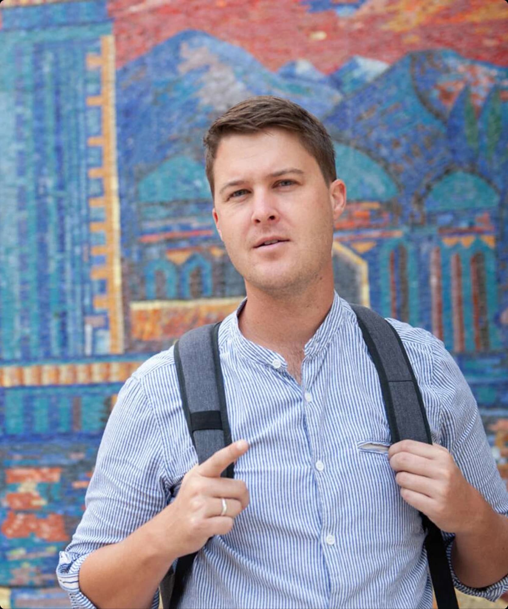 Dennis Keen in front of a Soviet mosaic